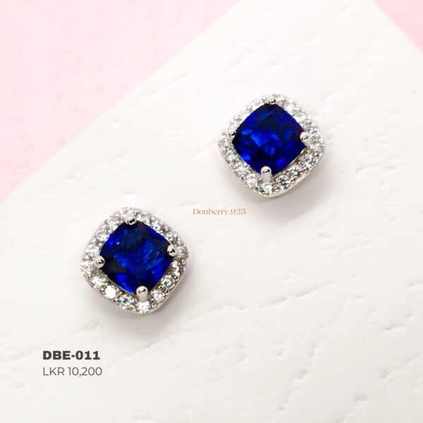 diamond woith square shaped small blue  stone
